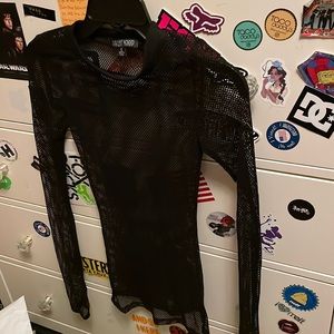 Black fishnet shirt with thumb holes. Never worn. Bought from dolls kill.